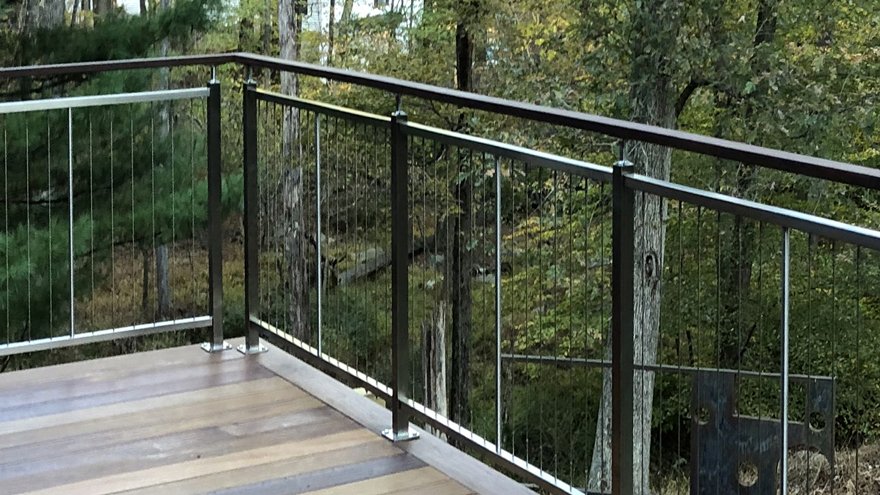 Vertical cable railing on deck. Outside railing project idea.